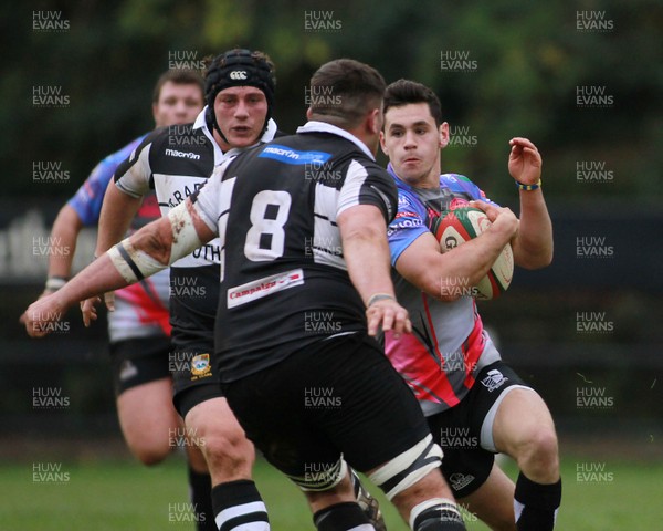 011114 - Pontypridd RFC v Bedwas RFC - Principality Premiership -Tomos Williams of Pontypridd takes on Dan Crimmins of Bedwas