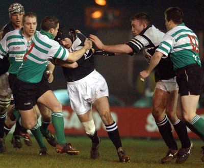 210203 - Pontypridd v Caerphilly - Welsh Premiership - Caerphilly's Sam Cox tries to stop Geraint Lewis