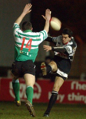 210203 - Pontypridd v Caerphilly - Welsh Premiership - Caerphilly's Ryan Howells attempts to charge down a Jason Lewis kick