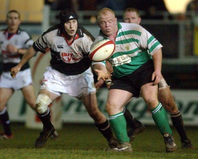 210203 - Pontypridd v Caerphilly - Welsh Premiership - Caerphilly's Darren Sweet and Geraint Lewis go for a loose ball