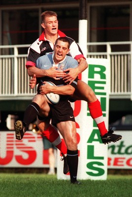 160897 - Pontypridd v Cardiff - Matthew Silva is tackled by Daffyd James