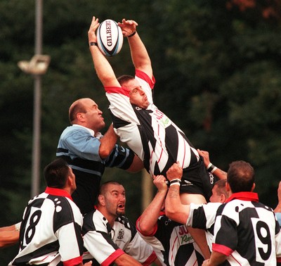 160897 - Pontypridd v Cardiff - Greg Prosser beats Derwyn Jones to the ball