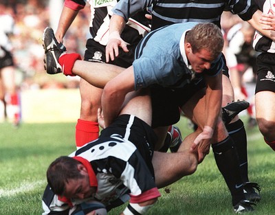 160897 - Pontypridd v Cardiff - David Manley is tackled by Leigh Davies