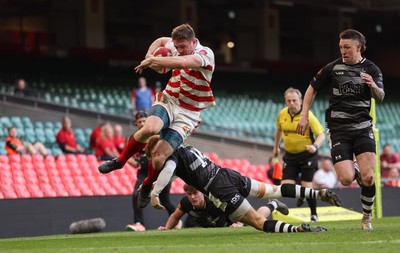 050425  Pontypridd v Cross Keys, WRU Premiership Cup Final -Louis Rocheford-Shugar of Pontypridd is tackled by Laurence Donnelly of Cross Keys