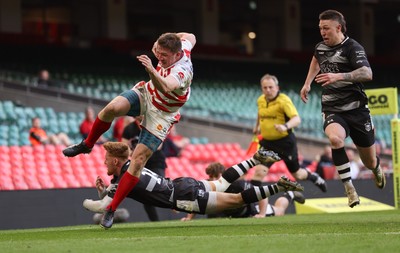 050425  Pontypridd v Cross Keys, WRU Premiership Cup Final -Louis Rocheford-Shugar of Pontypridd is tackled by Laurence Donnelly of Cross Keys