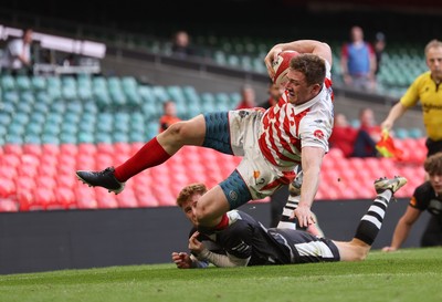 050425  Pontypridd v Cross Keys, WRU Premiership Cup Final -Louis Rocheford-Shugar of Pontypridd is tackled by Laurence Donnelly of Cross Keys