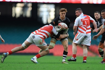 050425  Pontypridd v Cross Keys, WRU Premiership Cup Final - Laurence Donnelly of Cross Keys takes on Joe Miles of Pontypridd