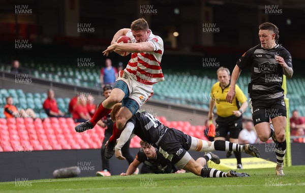 050425  Pontypridd v Cross Keys, WRU Premiership Cup Final -Louis Rocheford-Shugar of Pontypridd is tackled by Laurence Donnelly of Cross Keys