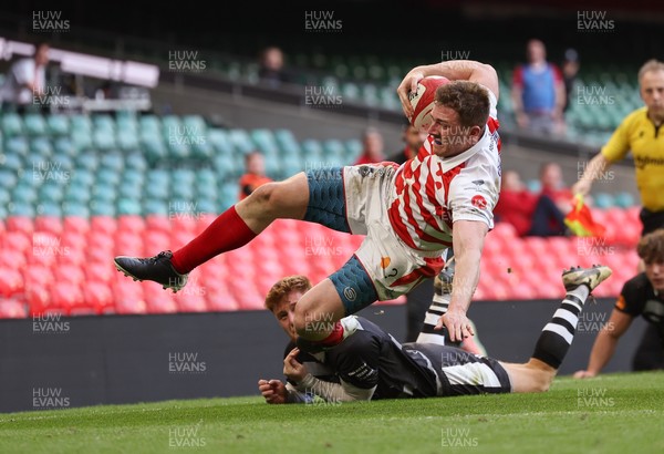050425  Pontypridd v Cross Keys, WRU Premiership Cup Final -Louis Rocheford-Shugar of Pontypridd is tackled by Laurence Donnelly of Cross Keys