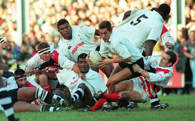 041195 - Pontypridd v Fiji - Paul John tackles Jason McLennan