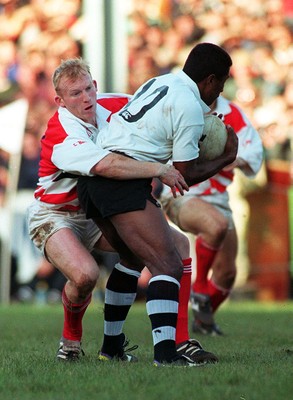 041195 - Pontypridd v Fiji - Neil Jenkins of Pontypridd stops Opeti Turuva