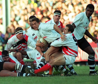 041195 - Pontypridd v Fiji - Paul John of Pontypridd tackles Jason McLennan