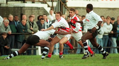 041195 - Pontypridd v Fiji - David Manley of Pontypridd is tackled by Emori Bolobolo