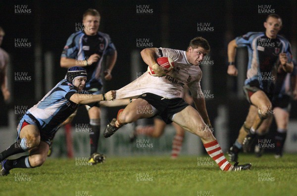 22.09.10.. Pontypridd v Glamorgan Wanderers, Principality Premiership - Pontypridd's Darren Waters is caught by Chris Greenfield 