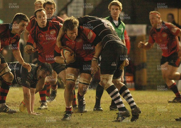 050413 Pontypridd RFC v Jersey RFC - British and Irish Cup -Jersey's Paul Rodgers takes on Pontypridd's Owen Sheppard