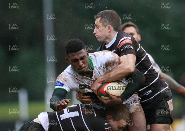 151212 Pontypridd RFC v Leeds Carnegie RFC - British and Irish Cup -Leeds' Jamel Chisholm is tackled by Pontypridd's Chris Clayton(L) and Gareth Wyatt