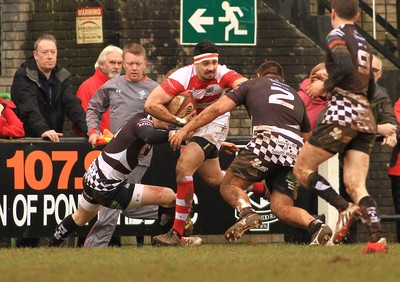 280315 - Pontypridd RFC v Llandovery RFC - Swalec Cup -Mike Evans of Llandovery takes on Owen Jenkins(L) and Liam Belcher of Pontypridd