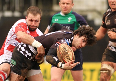 280315 - Pontypridd RFC v Llandovery RFC - Swalec Cup -Owen Jenkins of Pontypridd is tackled by James Garland of Llandovery