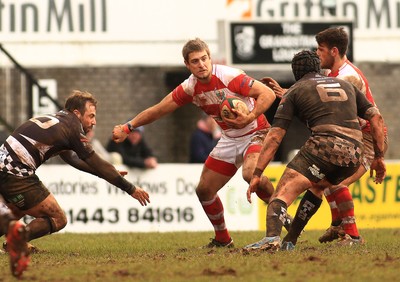 280315 - Pontypridd RFC v Llandovery RFC - Swalec Cup -Matthew Jacobs of Llandovery takes on Simon Humberstone(L) and Jake Thomas of Pontypridd