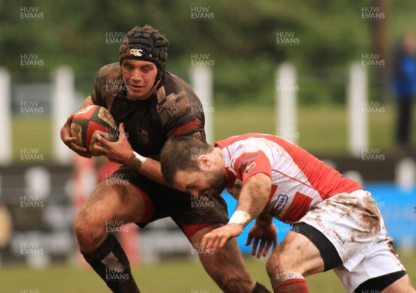 280315 - Pontypridd RFC v Llandovery RFC - Swalec Cup -Jake Thomas of Pontypridd is tackled by James Garland of Llandovery