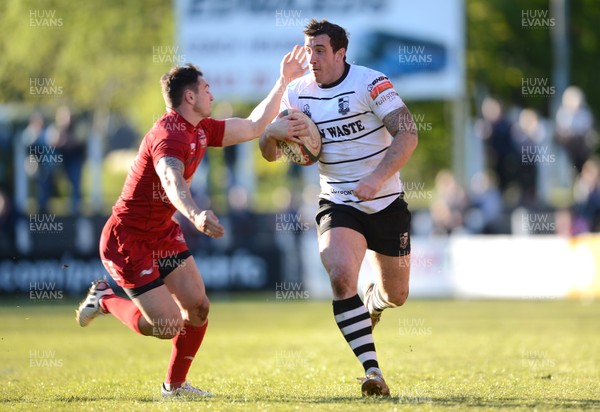 180513 - Pontypridd v Llanelli - Principality Premiership Final -Dafydd Lockyer of Pontypridd is tackled by Kristian Phillips of Llanelli 