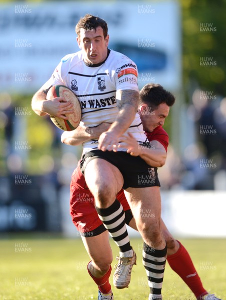 180513 - Pontypridd v Llanelli - Principality Premiership Final -Dafydd Lockyer of Pontypridd is tackled by Kristian Phillips of Llanelli 