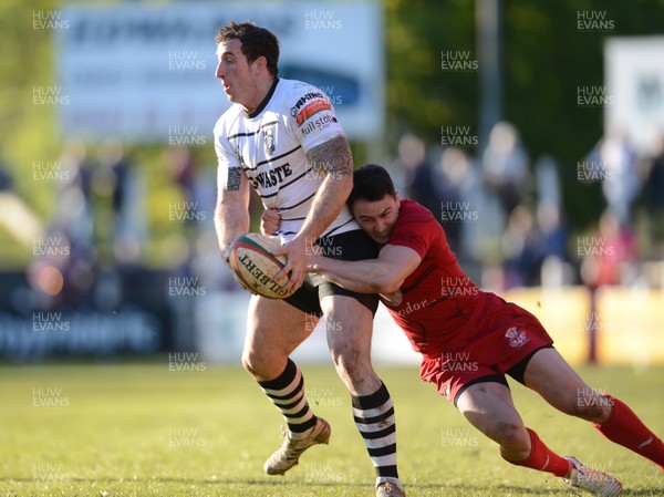 180513 - Pontypridd v Llanelli - Principality Premiership Final -Dafydd Lockyer of Pontypridd is tackled by Kristian Phillips of Llanelli 