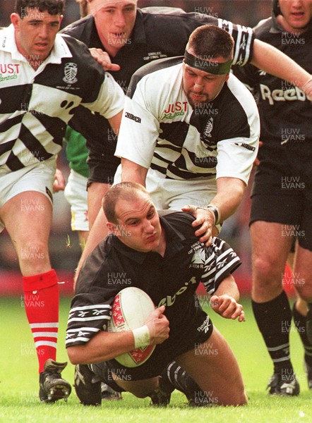 040596 - Pontypridd v Neath - SWALEC Cup Final -  Neath's Ian Boobyer is tackled by Mark Rowley 