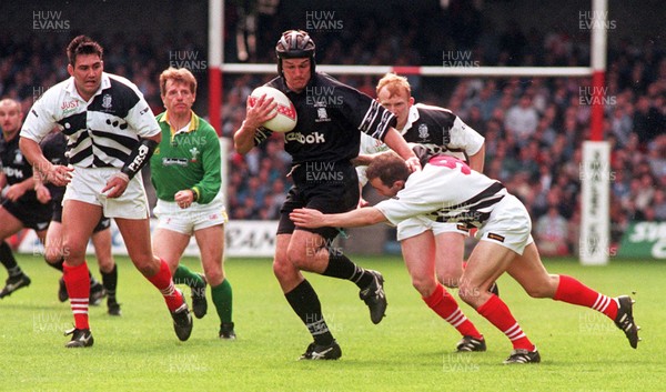 040596 - Pontypridd v Neath - SWALEC Cup Final -  Neath's Robin Jones hands off Paul John 