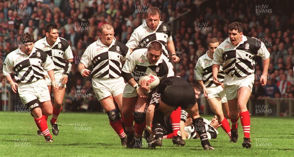 040596 - Pontypridd v Neath - SWALEC Cup Final -  Neil Eynon of Pontypridd is tackled by Ian Boobyer but has (L-R) Phil John, Dale McIntosh, Greg Prosser, Paul John and Matthew Lloyd in support