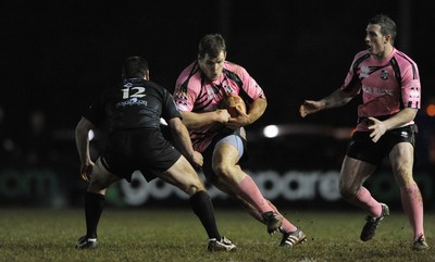 10.03.11 - Pontypridd v Neath - Principality Premiership - Sam Hobbs of Pontypridd takes on Gareth McCarthy of Neath. 