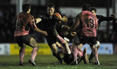 10.03.11 - Pontypridd v Neath - Principality Premiership - Gareth King of Neath is stopped by Simon Humberstone on Pontypridd. 