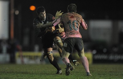 10.03.11 - Pontypridd v Neath - Principality Premiership - Lee Evans of Neath takes on Simon Humberstone of Pontypridd. 