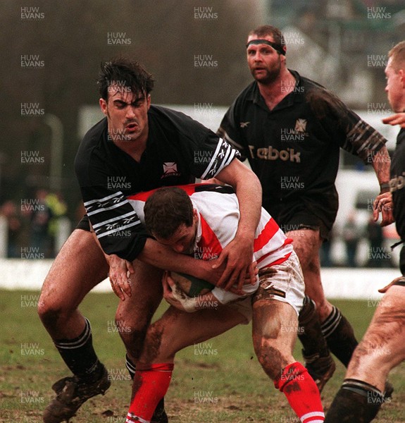 110395 - Pontypridd v Neath - Paul John of Pontypridd is tackled by Chris Scott of Neath