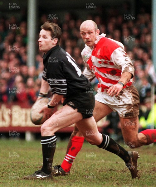 110395 - Pontypridd v Neath - Matthew McCarthy of Neath is pursued by Richie Collins