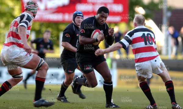 130503 - Pontypridd v Neath - Welsh Premiership - Neath's Alfie Mocelutu looks for a gap between Brent Cockbain and Neil Jenkins