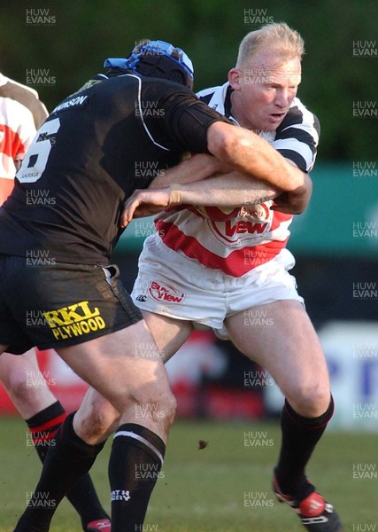 130503 - Pontypridd v Neath - Welsh Premiership - Ponty's Neil Jenkins runs into Brett Sinkinson