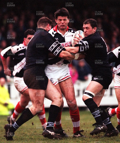 250497 - Pontypridd v Neath - Crispin Cormack is tackled by Paul Williams and Gareth Newman