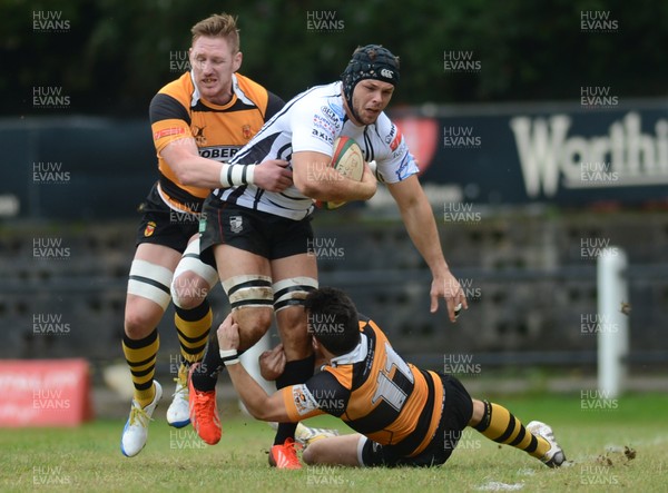 290913 - Pontypridd v Newport - Principality Premiership -Luke Anthony Crocker of Pontypridd is tackled by Lee Beach and Tom James of Newport