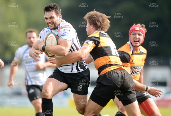 290913 - Pontypridd v Newport - Principality Premiership -Gavin Dacey of Pontypridd is tackled by Geraint O'Driscoll of Newport