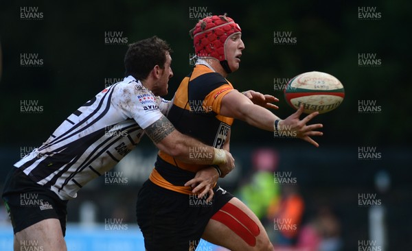 290913 - Pontypridd v Newport - Principality Premiership -Tyler Morgan of Newport is tackled by Dafydd Lockyer of Pontypridd