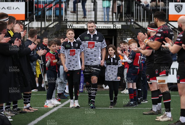 270124 - Pontypridd v Pontypool - Indigo Premiership - Chris Dicomidis of Pontypridd walks out onto the field with his children on his 400th game for the club