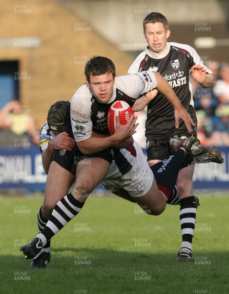 09.04.11 Pontypridd v Swansea SWALEC CUP Semi-Final Ponty's Adam Thomas is tackled by Steffan Jones. 