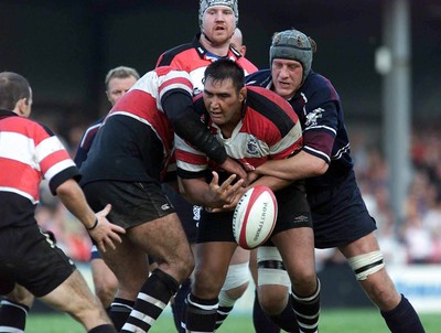 260800 - Pontypridd v Swansea - Pontypridd's Dale McIntosh loses possession as Andy Moore tackles