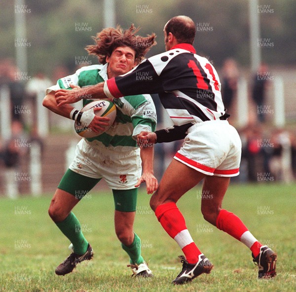 121096 - Pontypridd v Treviso - Leonardo Perziano of Treviso is tackled by Phil Ford