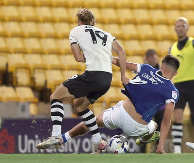 070825 - Port Vale v Cardiff City - Sky Bet League 1 - Ben Waine of Port Vale brings down Rubin Colwill of Cardiff near the end of the match