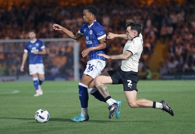 070825 - Port Vale v Cardiff City - Sky Bet League 1 - Chris Willock of Cardiff is tackled by Mitch Clark of Port Vale