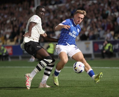 070825 - Port Vale v Cardiff City - Sky Bet League 1 - Isaak Davies of Cardiff and Jesse Debrah of Port Vale