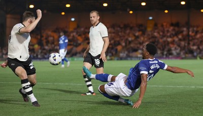070825 - Port Vale v Cardiff City - Sky Bet League 1 - Chris Willock of Cardiff tries to put the ball past Kyle John of Port Vale