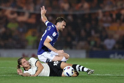 070825 - Port Vale v Cardiff City - Sky Bet League 1 - Calum Chambers of Cardiff lands on Lorent Tolaj of Port Vale